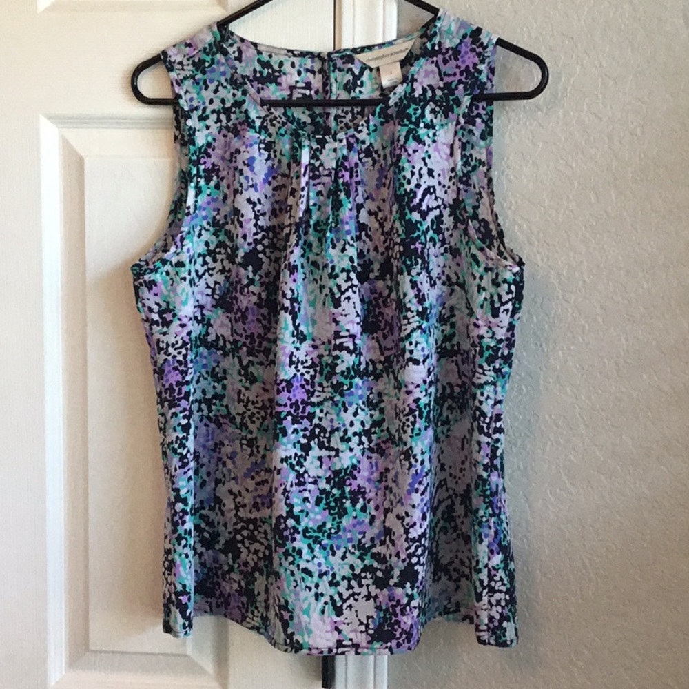 Sleeveless fun summer top.  Nice pleated neckline.